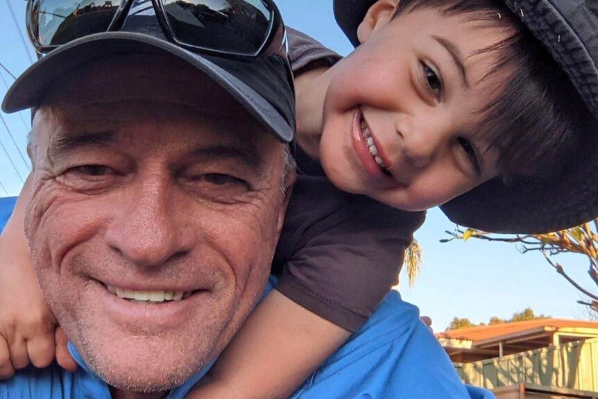 A close up selfie of the pair, where Hemi is being piggy-backed by Chris