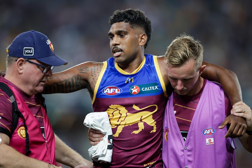 Keidean Coleman is taken from the field with a knee injury.