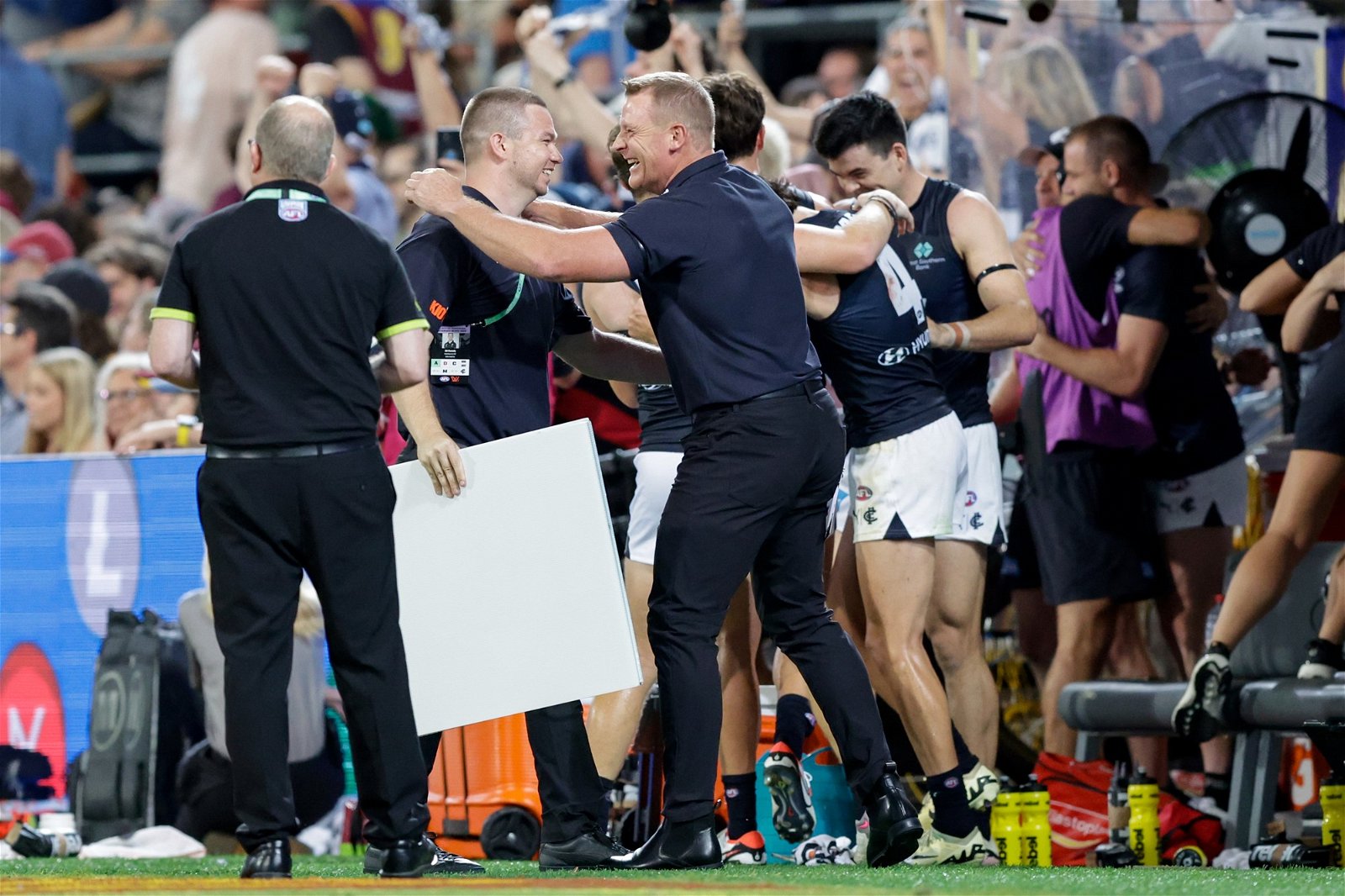 The Carlton bench reacts after a win over Brisbane at the Gabba.