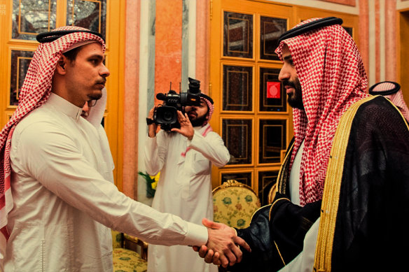 In this photo from the Saudi Press Agency in 2018, the Crown Prince shakes hands with Khashoggi’s son Salah, who was under a travel ban.