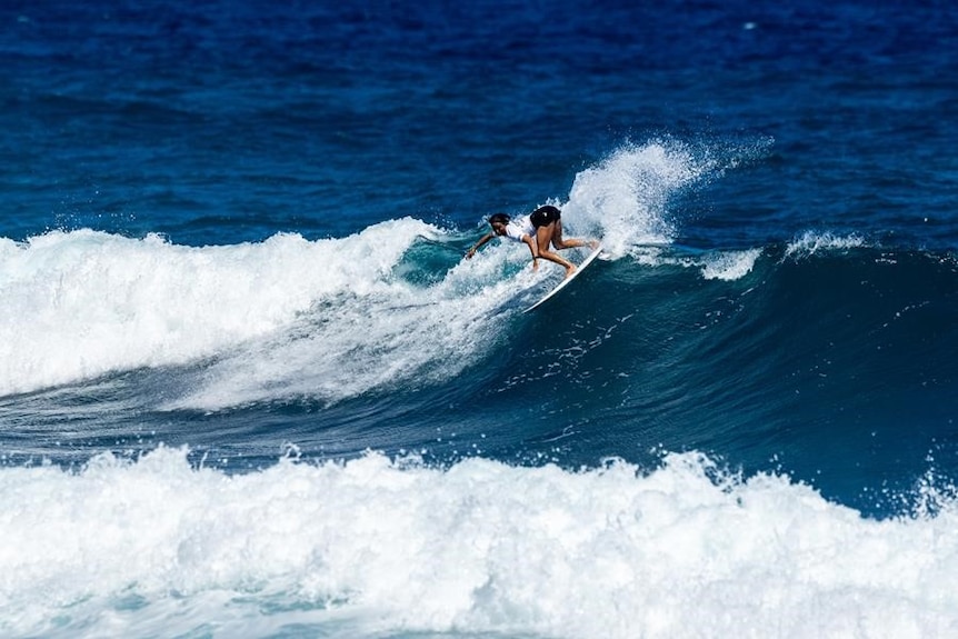 Sally Fitzgibbons rides a wave