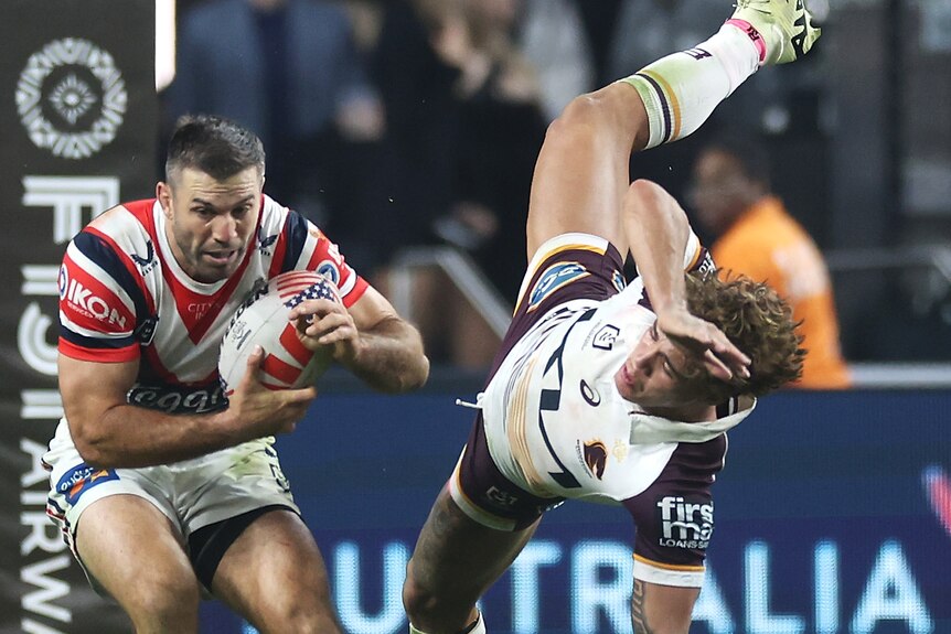 Reece Walsh goes flying past James Tedesco