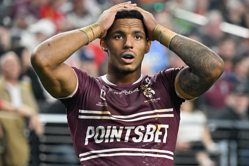 Jason Saab with both his hands on his head during Manly's Las Vegas NRL match against South Sydney.