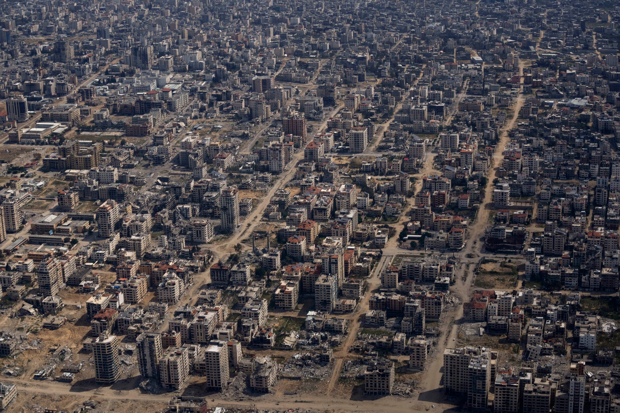 Destroyed buildings as seen through the window of a US Air Force plane overflying the Gaza Strip. Photo: AP