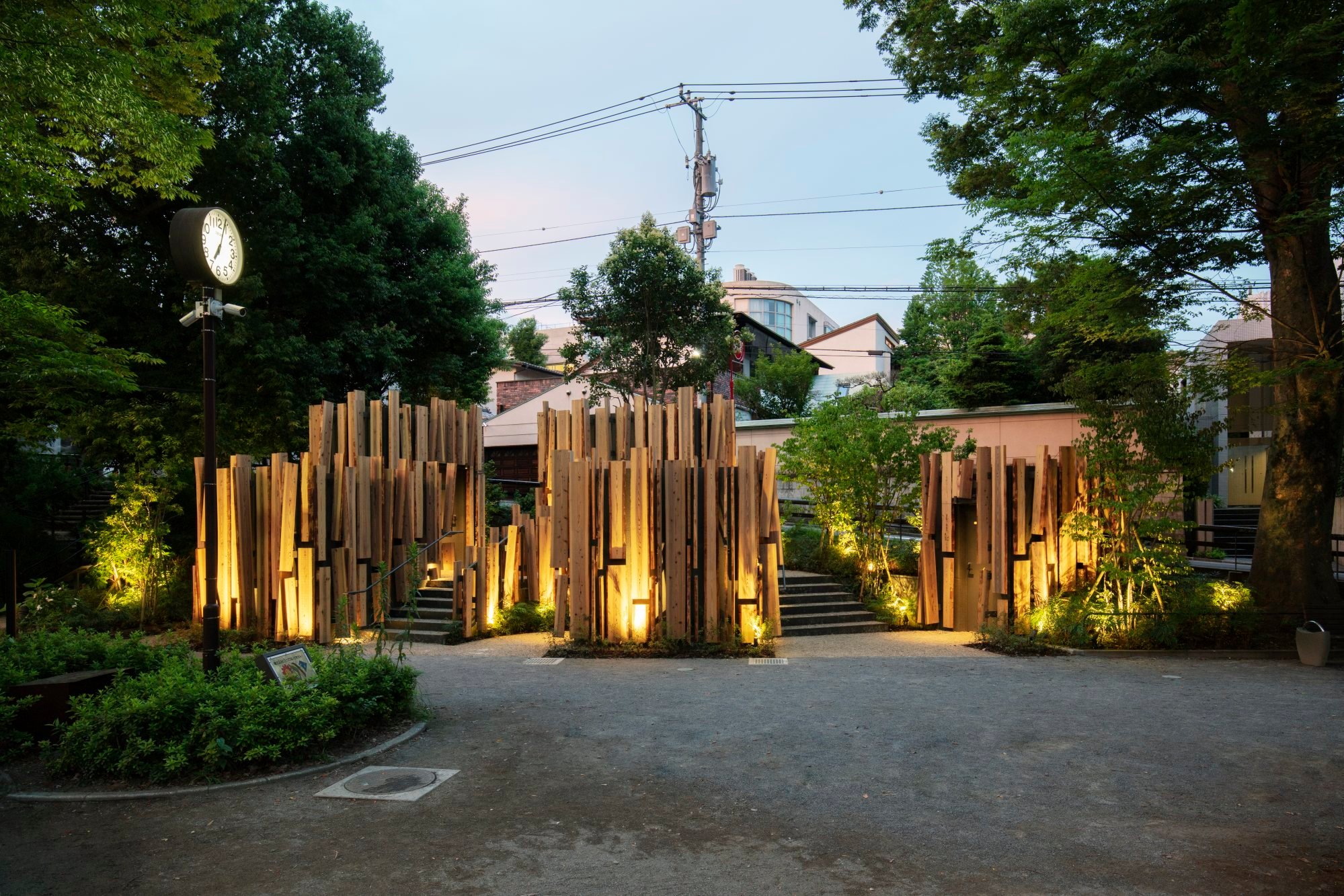 A “village” of five huts made of cedar boards and titled “A Walk in the Woods”, in Nabeshima Shoto Park in Tokyo. Photo: Satoshi Nagare, courtesy of the Nippon Foundation