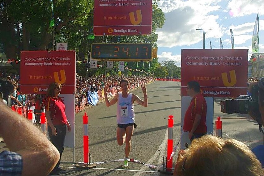 Record holder Neil Labinsky crosses the finishing line in 2011.