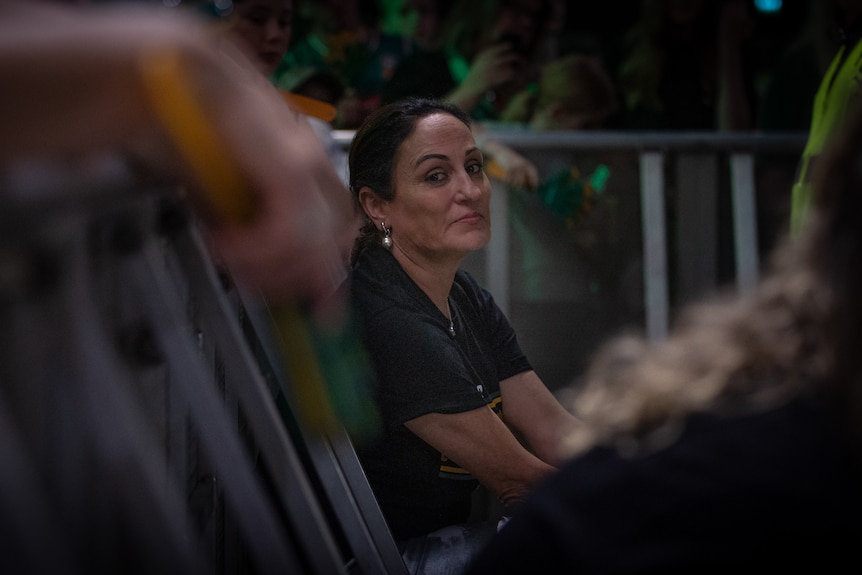 A woman in a black shirt.