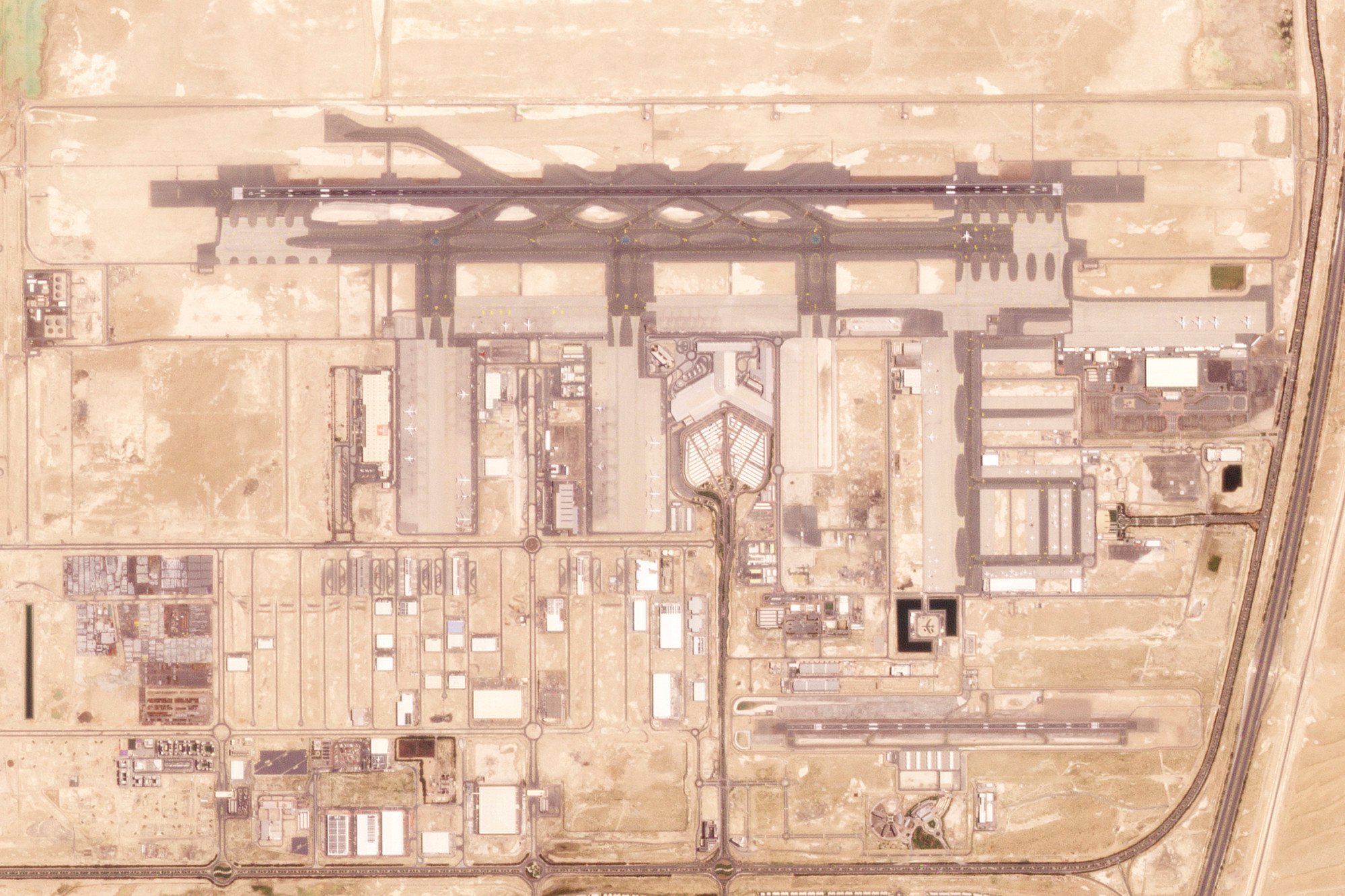 A satellite photo of Al Maktoum International Airport. Expansion plans include five parallel runways and 400 aircraft gates. Photo: Planet Labs PBC via AP