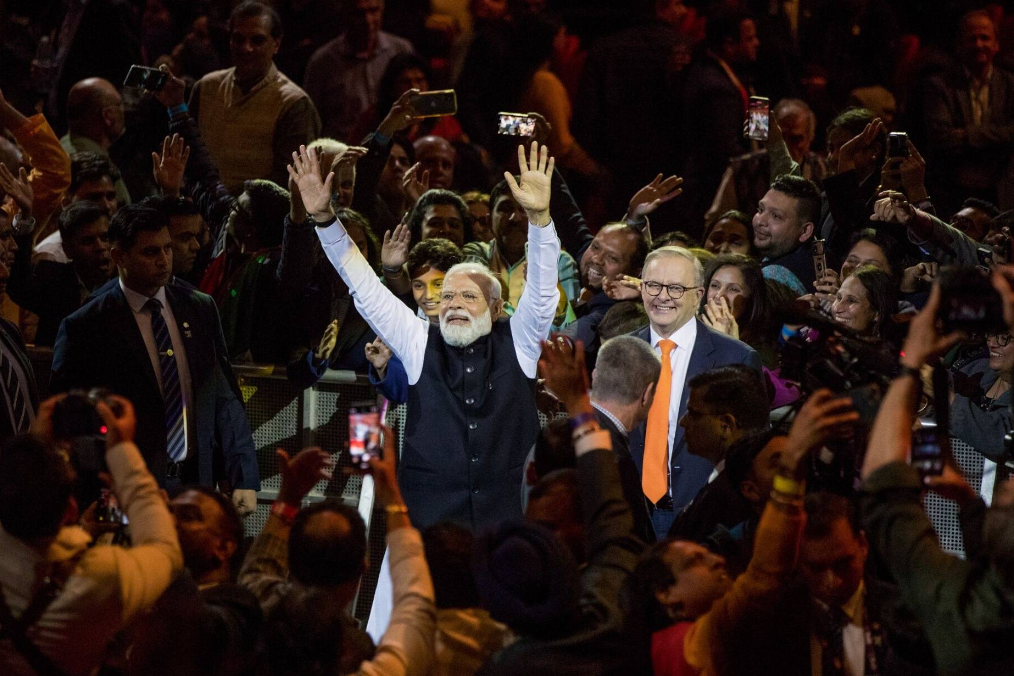 Indian Prime Minister Narendra Modi gestures to the crowd alongside his Australian counterpart Anthony Albanese (centre, right) in Sydney last year attended by thousands of expatriate Indians. Photo: Bloomberg