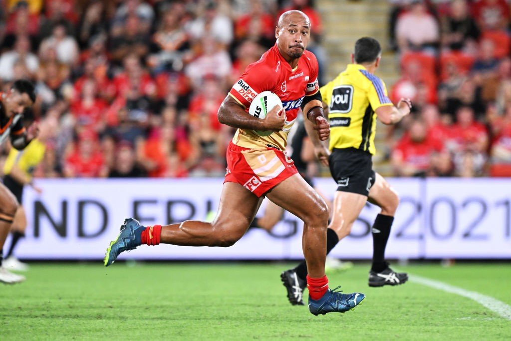 Dolphins' Felise Kaufusi runs with the ball during an NRL game.