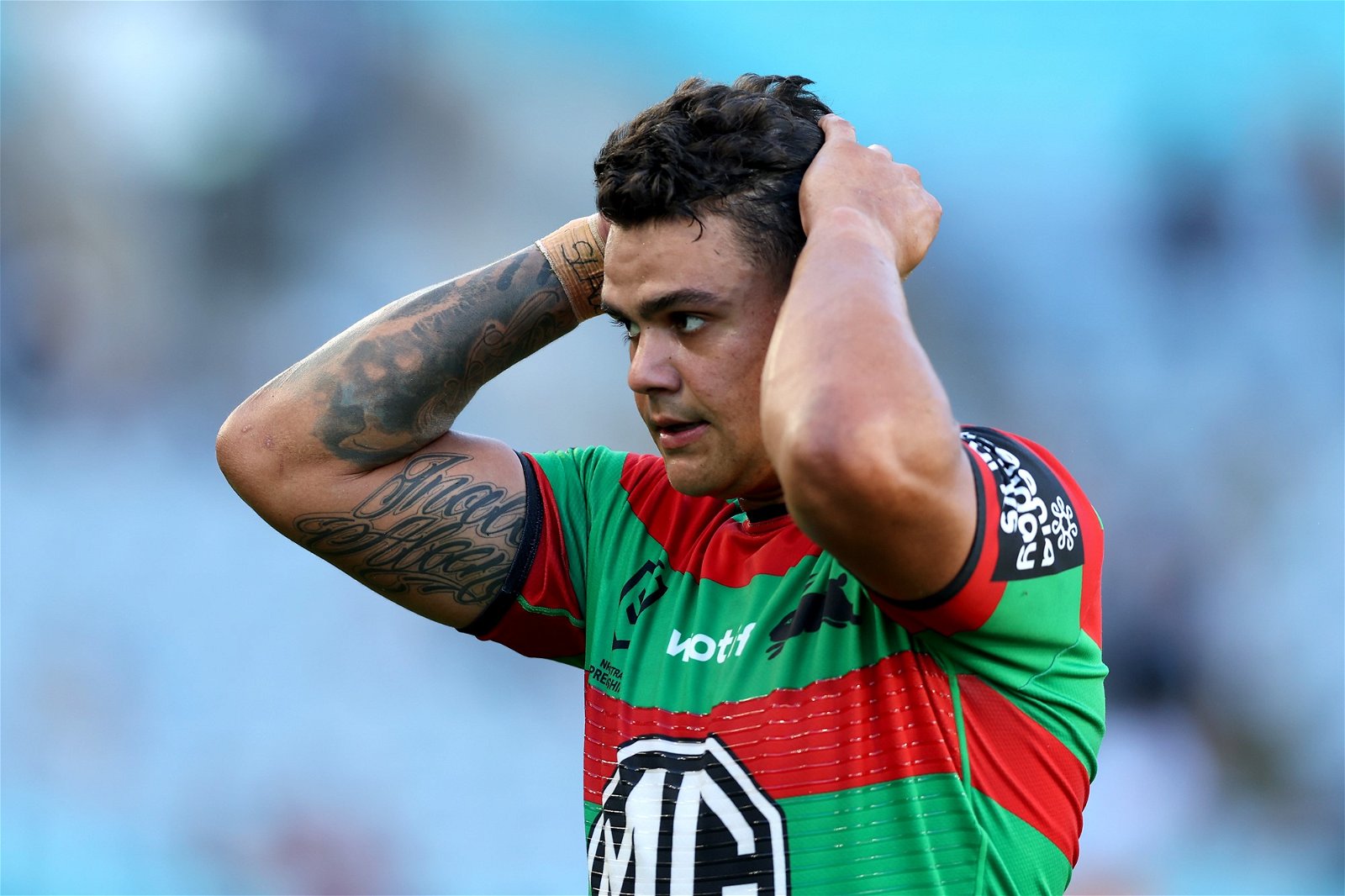 Latrell Mitchell runs his hands through his air during an NRL game.