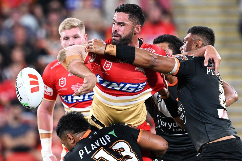 Jesse Bromwich offloads in a Tigers tackle.