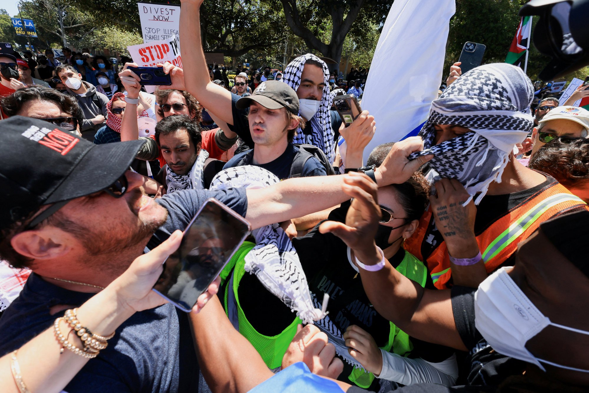 Pro-Palestinian protesters and Israel supporters scuffle at UCLA on Sunday. Photo: Reuters