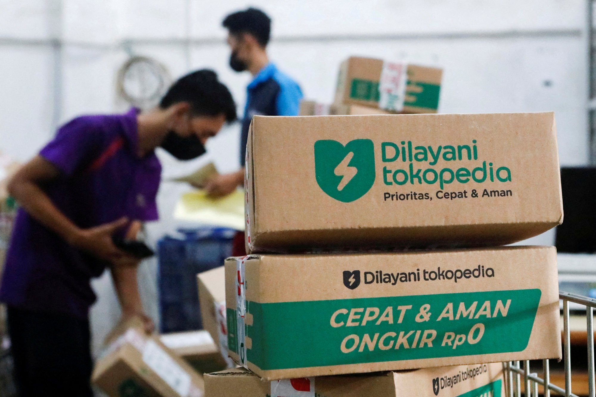Employees pack goods at a warehouse of GoTo’s e-commerce unit Tokopedia in Jakarta. GoTo is Indonesia’s biggest “decacorn”. Photo: Reuters