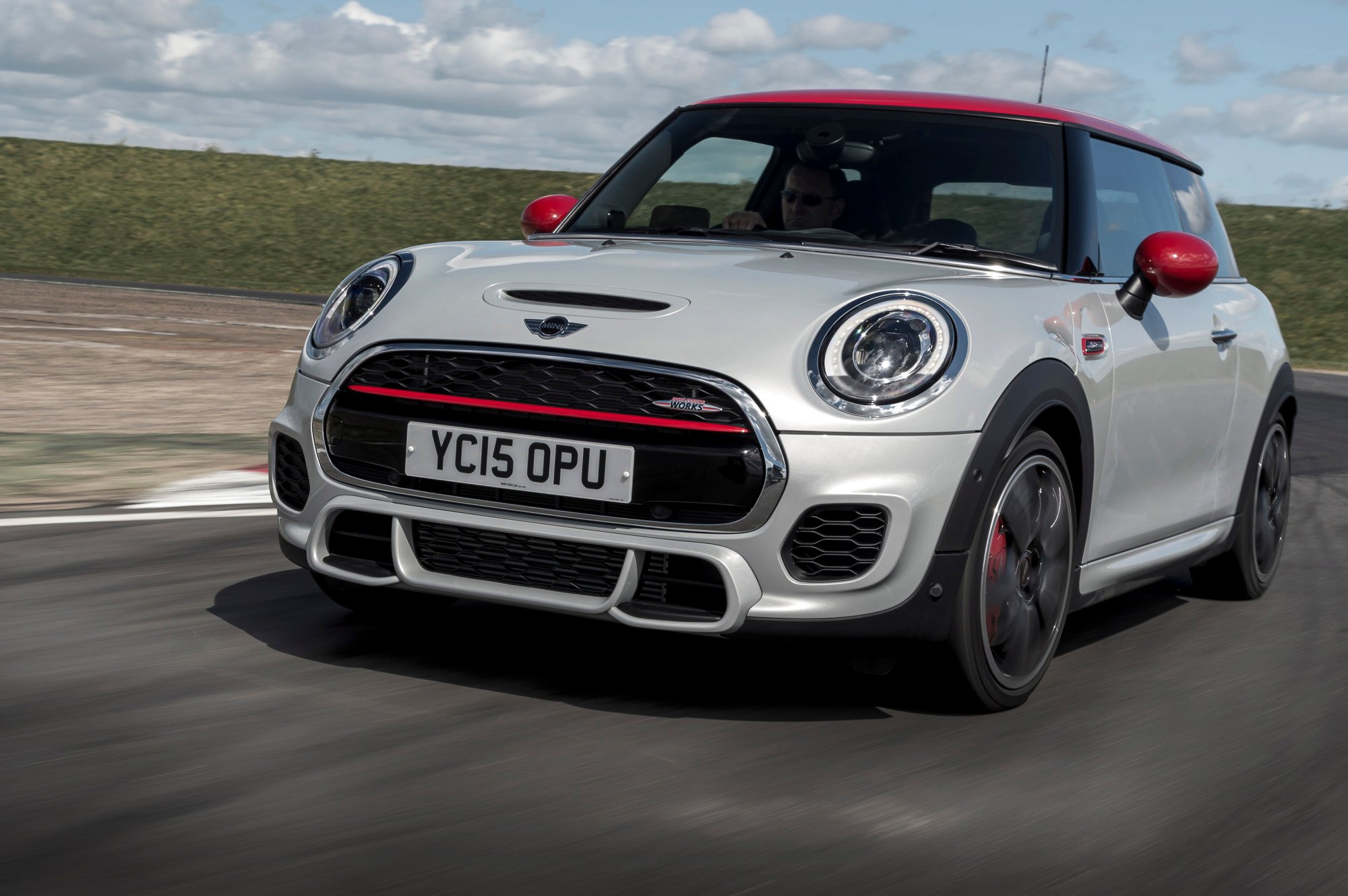 A Mini Cooper on a racetrack. Liu handed over his mother’s Mini Cooper SE and Rolls-Royce Dawn to a dealership in return for a US$110,000 deposit, the court heard. Photo: Max Earey/Handout