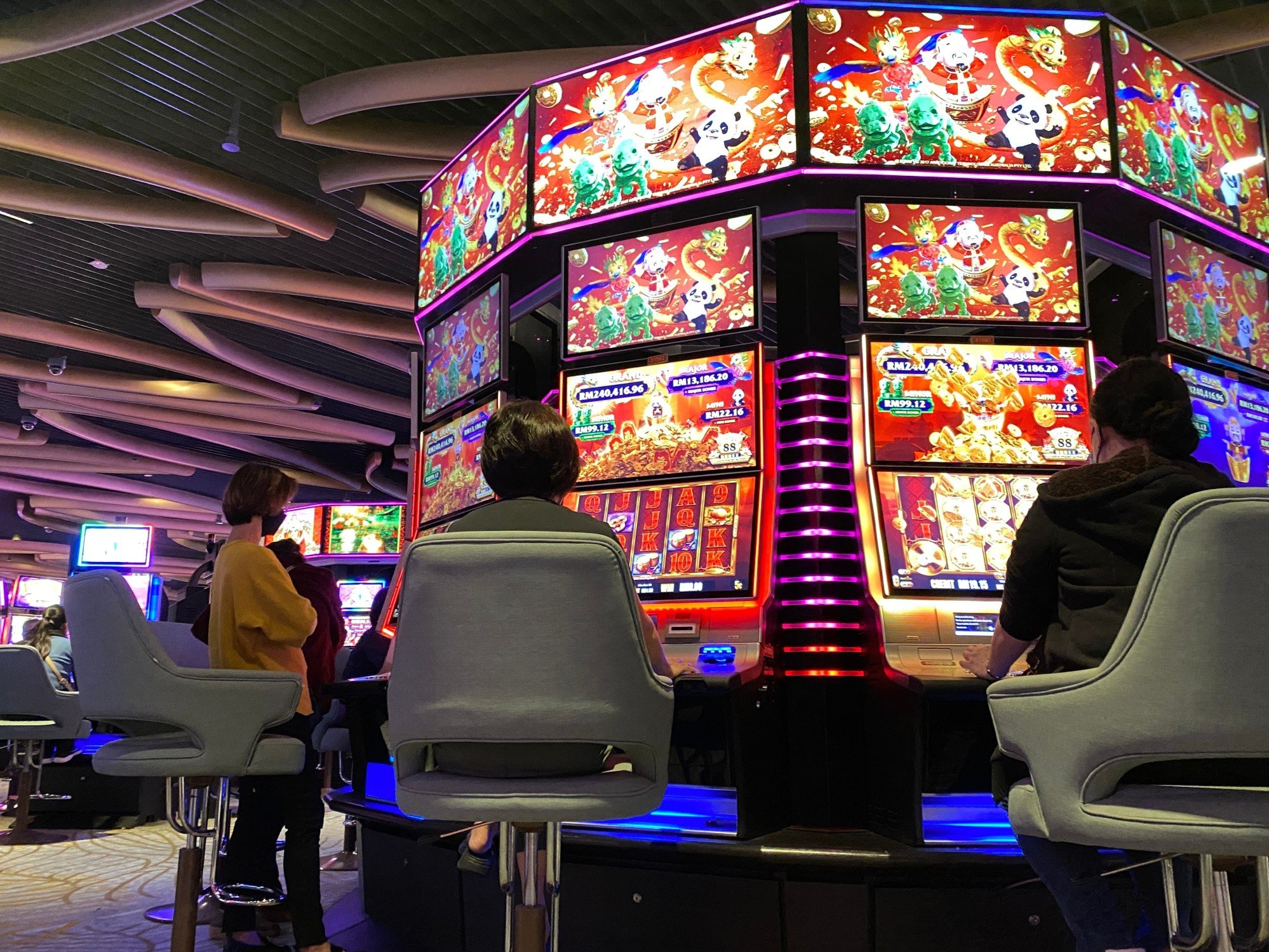 Gamblers try their luck on the slot machines at a casino in Resorts World Genting, Genting Highlands, Malaysia. Photo: Shutterstock