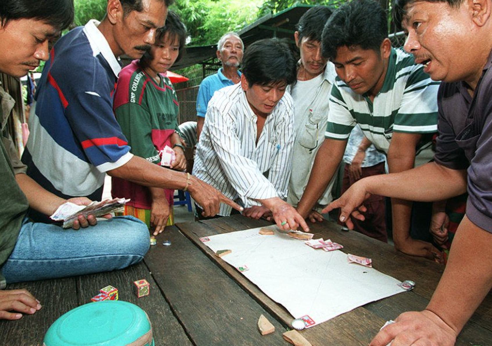 Street-side gamblers in Bangkok argues over bets in this file photo from 1996. Photo: AFP
