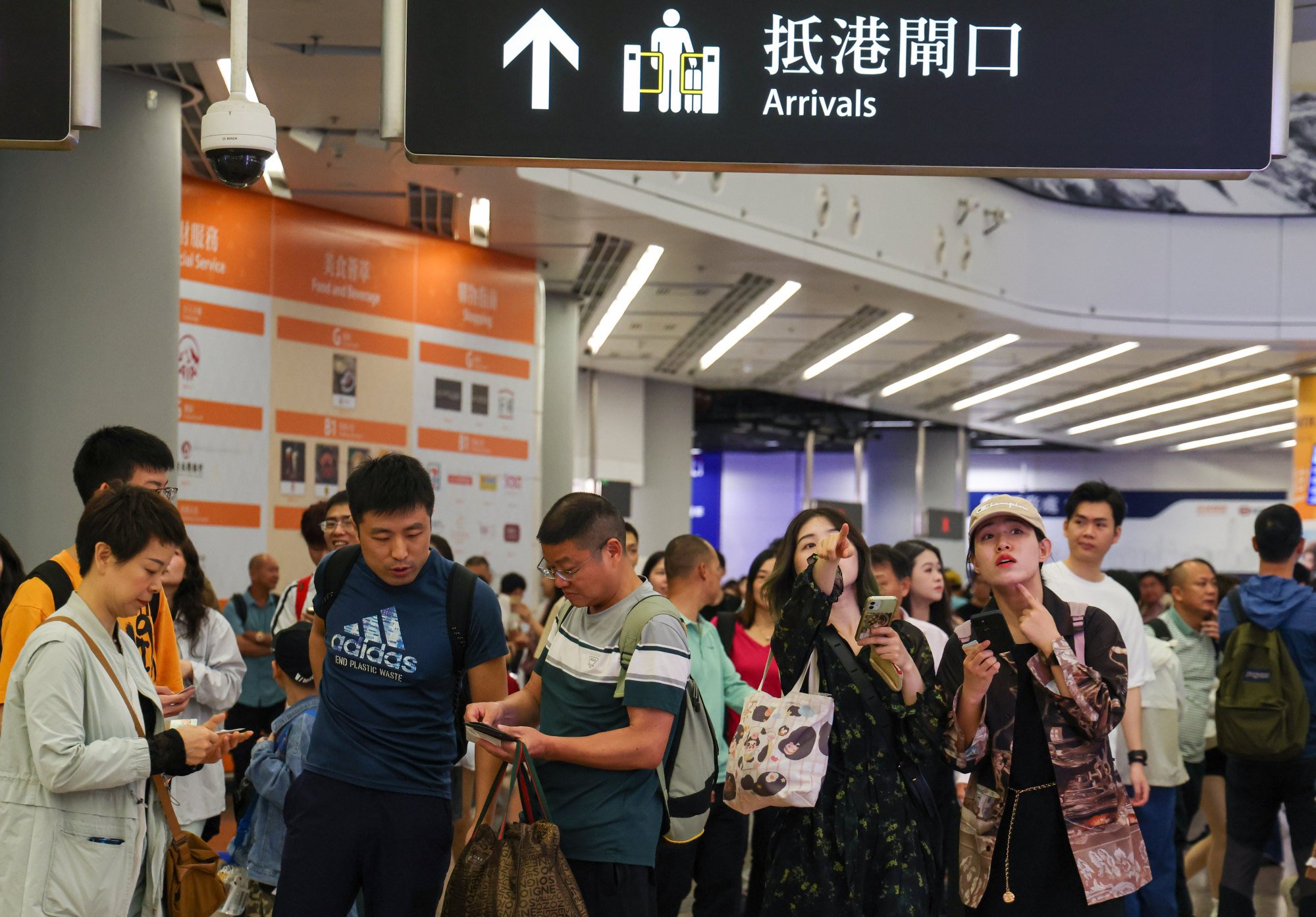 Hundreds of travellers were seen arriving in Hong Kong through the West Kowloon high-speed rail terminus. Photo: Jelly Tse