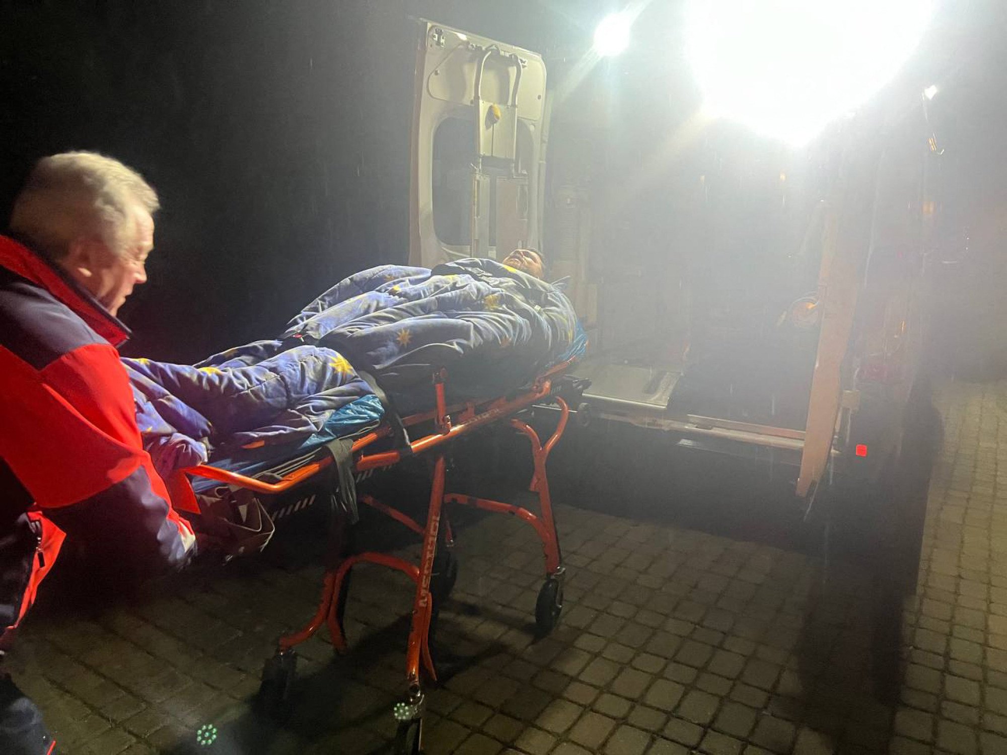 Leonid Volkov being loaded into an ambulance after he was attacked with a hammer. Photo: X user @teamnavalny via AFP