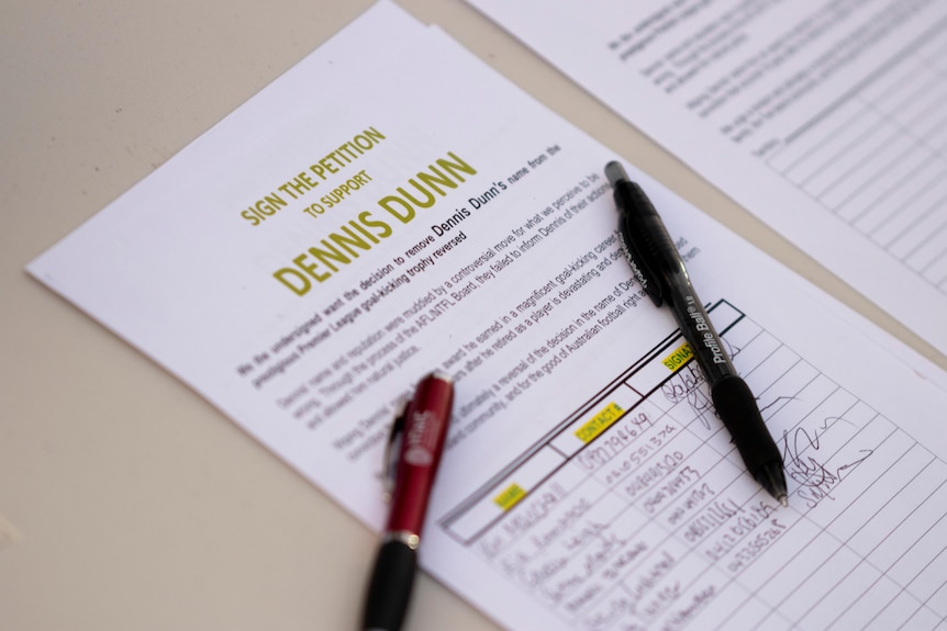 A petition for Dennis Dunn sits on a table.