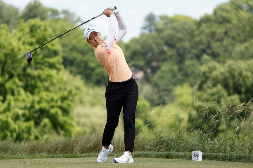 Golfer Minjee Lee hits a tee shot at the US Women's Open.
