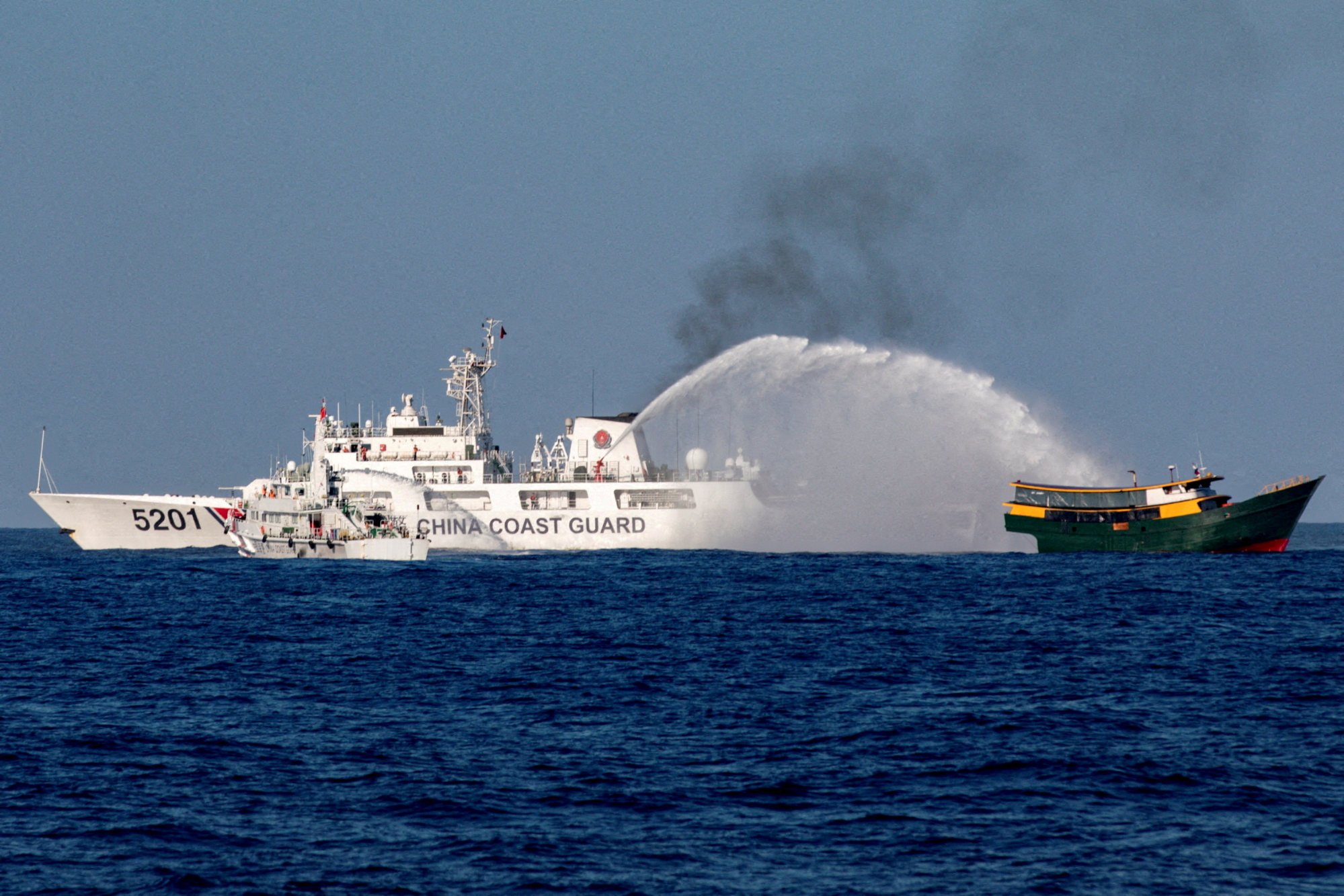 Chinese coastguard vessels fire water cannons at a Philippine resupply vessel Unaizah on May 4 as it sailed towards the Second Thomas Shoal in the South China Sea in March. Photo: Reuters