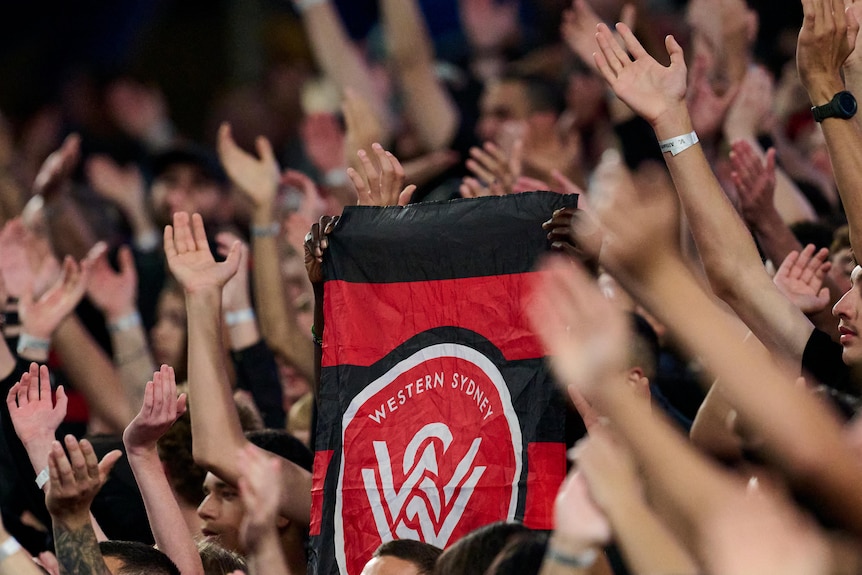 Western Sydney Wanderers flag in a crowd