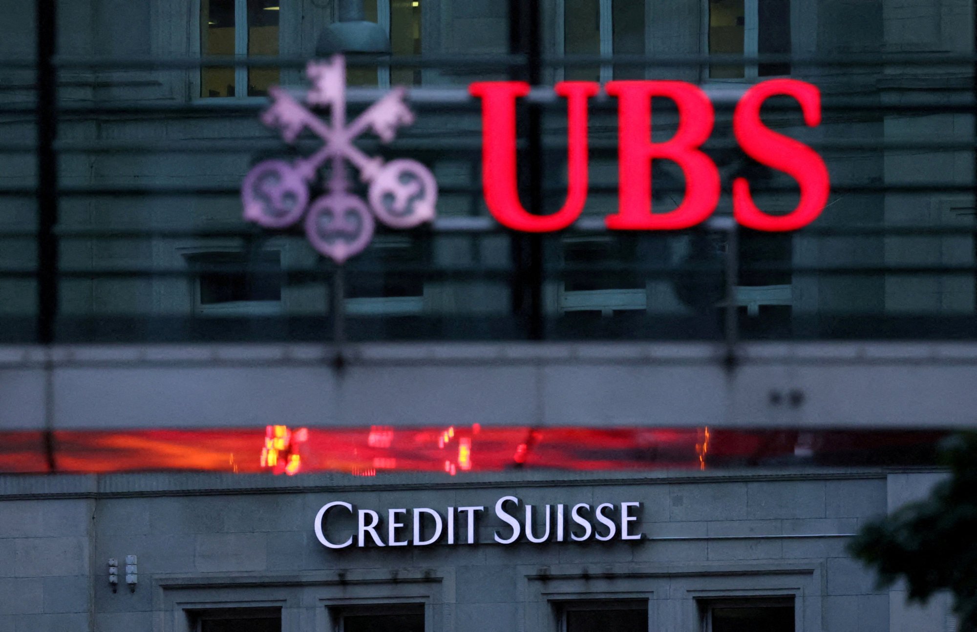 Logos of Swiss banks Credit Suisse and UBS are seen before a news conference in Zurich Switzerland. Photo: Reuters