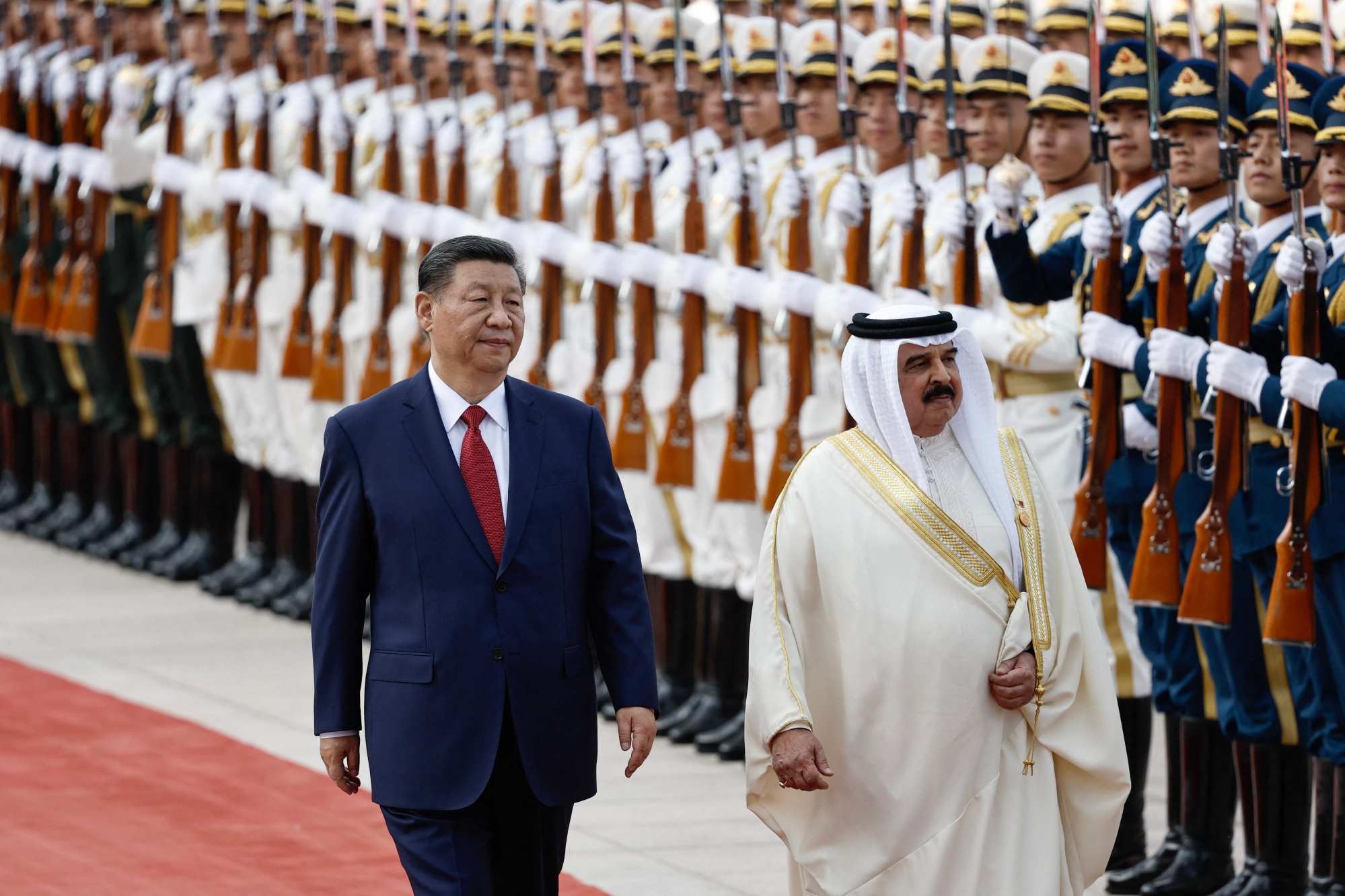 Bahrain’s king review an honour guard as he is received by China’s president during a welcome ceremony in Beijing on May 31. Photo: AFP