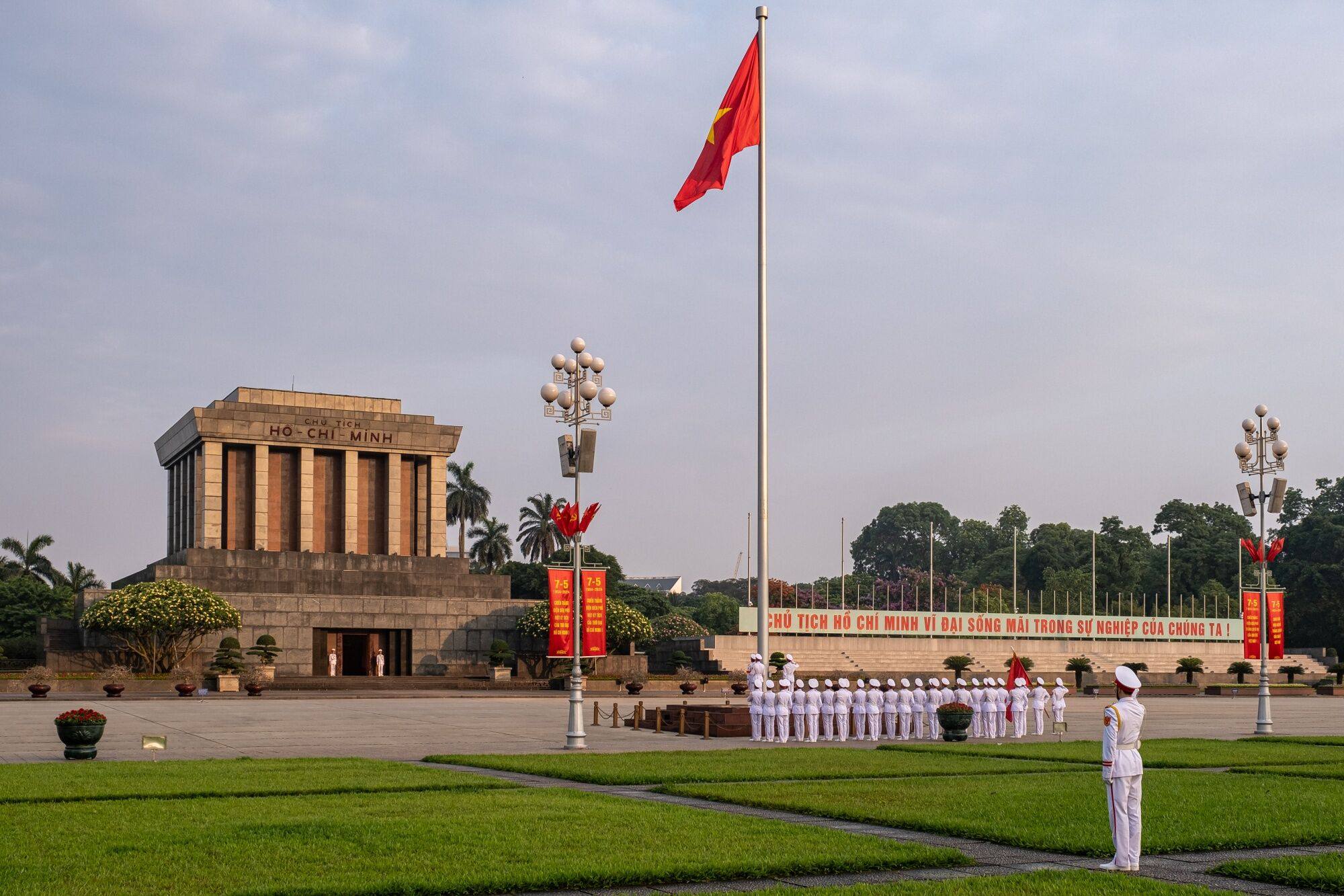Soldiers salute during the flag-rising ceremony at Ba Dinh Square, in front of the Ho Chi Minh Mausoleum, in Hanoi on May 14. Vietnam has a “very strict” policy against military alliances, according to former US Air Force colonel Ray Powell. Photo: Bloomberg