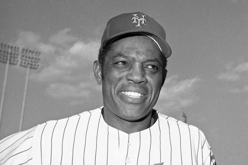 Willie Mays poses in a Mets uniform