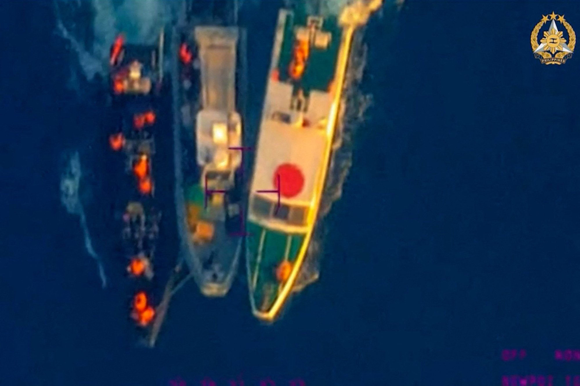A Philippine rigid hull inflatable boat sandwiched between two Chinese coastguard vessels during an incident off Second Thomas Shoal in the South China Sea. Photo: Handout / Armed Forces of the Philippines Public Affairs Office