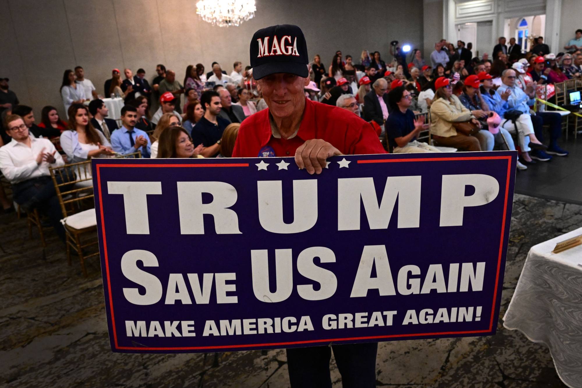 A Donald Trump supporter attends a watch party for the first debate of the 2024 presidential elections between US President Joe Biden and former US President and Republican presidential candidate Donald Trump in Miami. Photo: AFP
