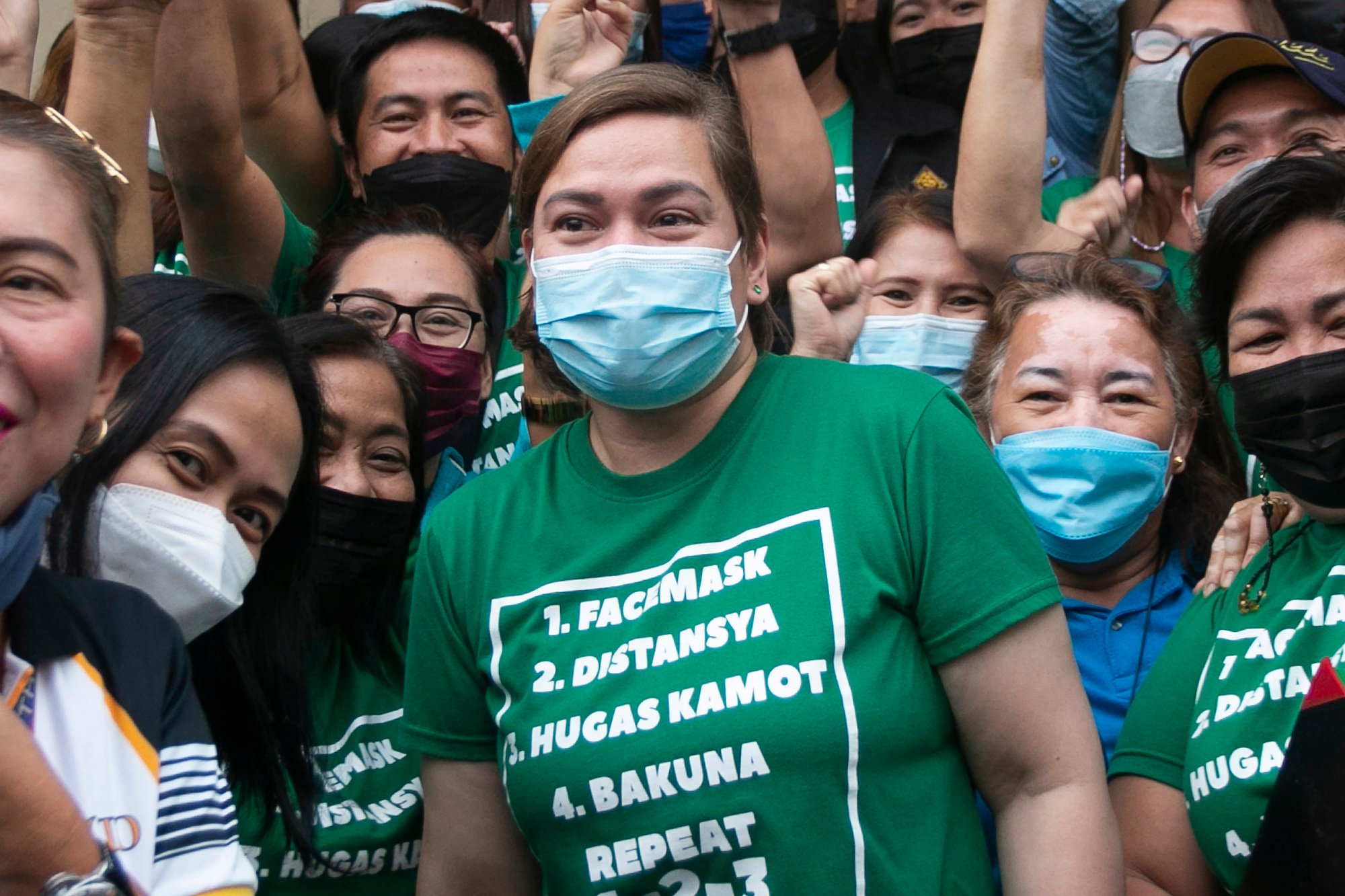 Davao City Mayor Sara Duterte (centre) poses for a selfie with supporters in Davao, the Philippines, in November 2021. Photo: AP
