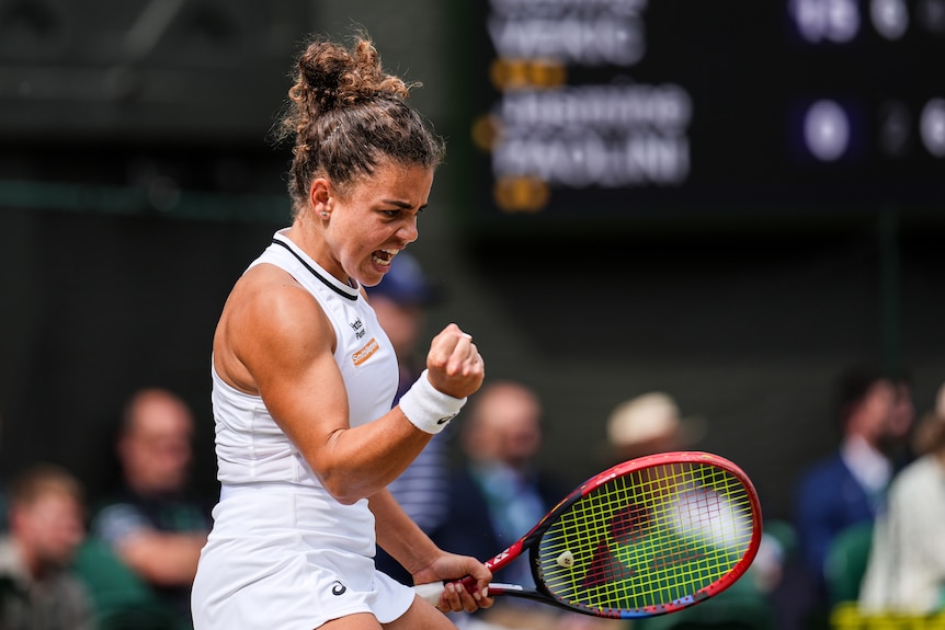 Jasmine Paolini celebrates winning a point by clenching her fists