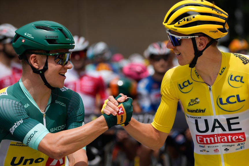 Jonas Abrahamsen shakes hands with Tadej Pogacar
