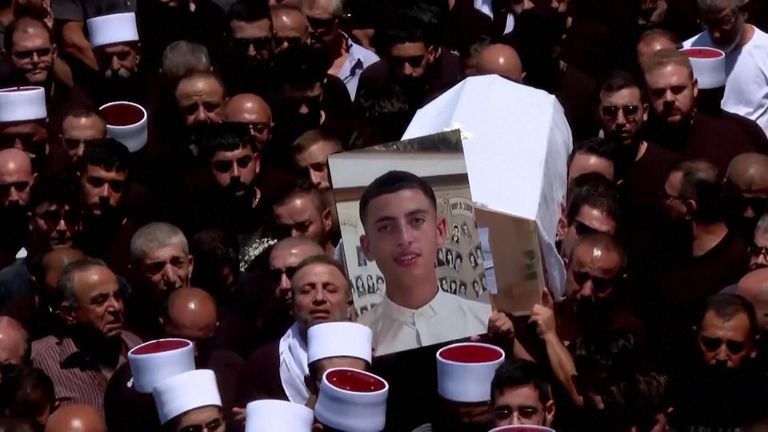 Thousands attend funeral of children and teens killed after a rocket hit Golan Heights football field 