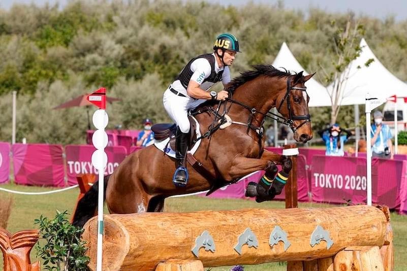Man riding a horse jumping during the Tokyo olympics