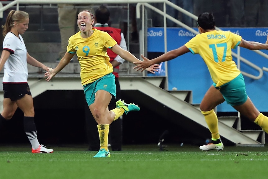 Caitlin Foord celebrates a goal against Germany in 2016, with teammate Kyah Simon.