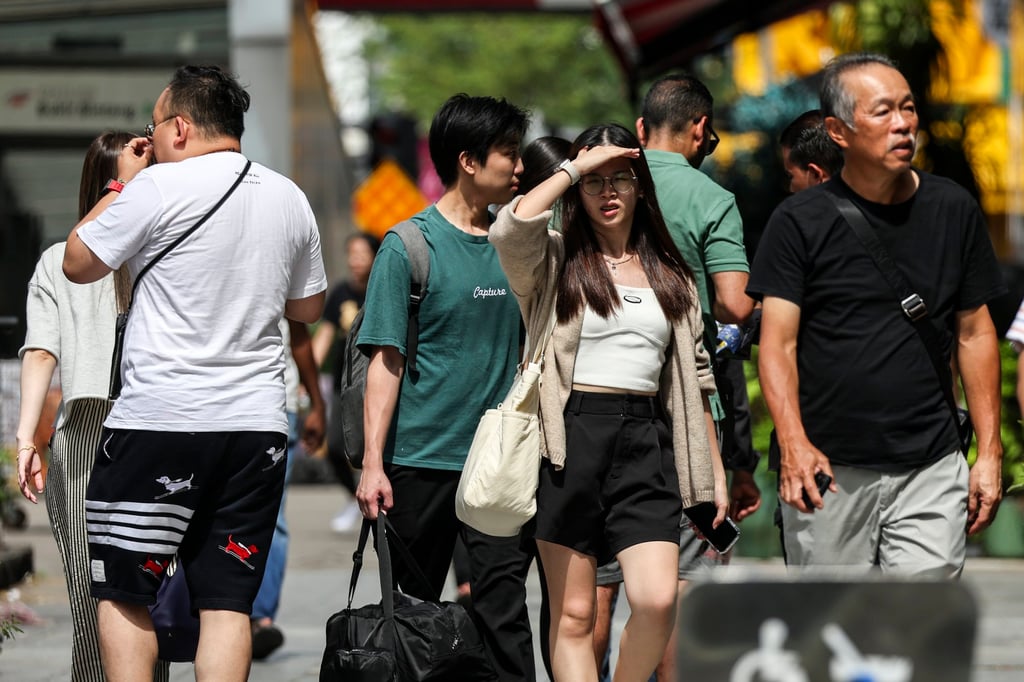 People walk in the street in Kuala Lumpur, Malaysia, earlier in July. Gerakan has helped soften PN’s Malay nationalist stance to widen its appeal to the country’s non-Malay vote base. Photo: EPA-EFE