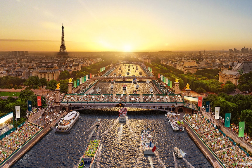 Boats displaying country flags sail down the Seine at sunset. Crowds of spectators line the river and bridges