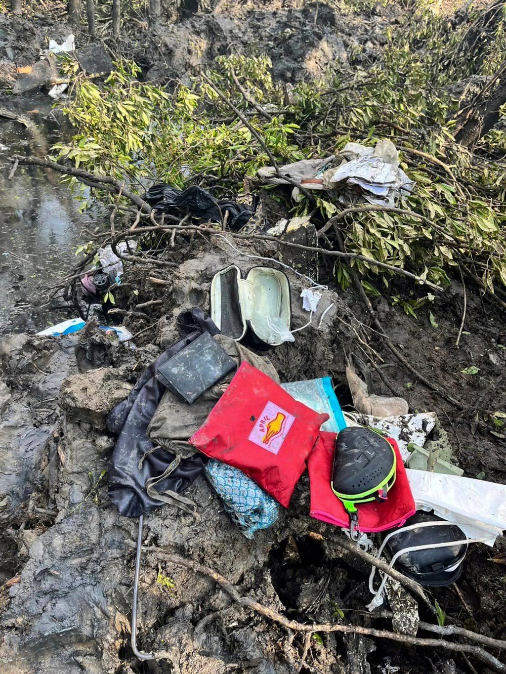 Passengers’ belongings are seen at the crash site in Chachoengsao province, Thailand, on Thursday. Photo: Chachoengsao’s Public Relations Department via AP