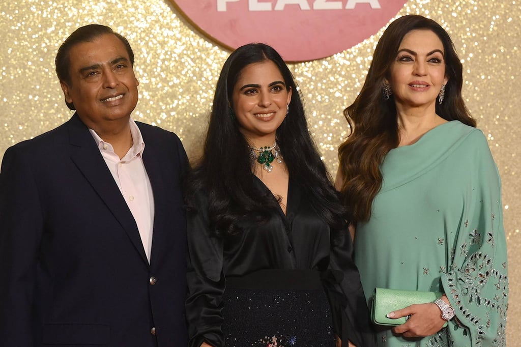 Mukesh Ambani, left, with his wife Nita, right, and daughter Isha, centre. Photo: AFP