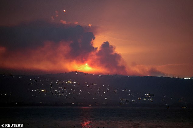 A view shows smoke and fire on the Lebanese side of the border with Israel