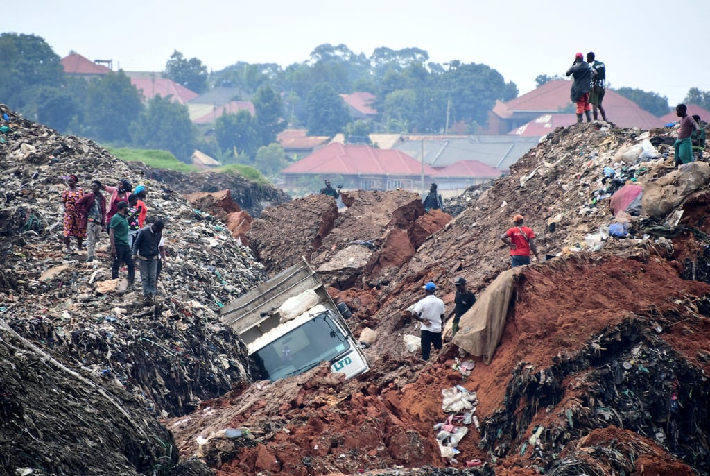 Volunteers search to retrieve the bodies of residents in a landfill known as Kiteezi that serves as garbage dumping site, in the Lusanja village outside Kampala. Photo: Reuters