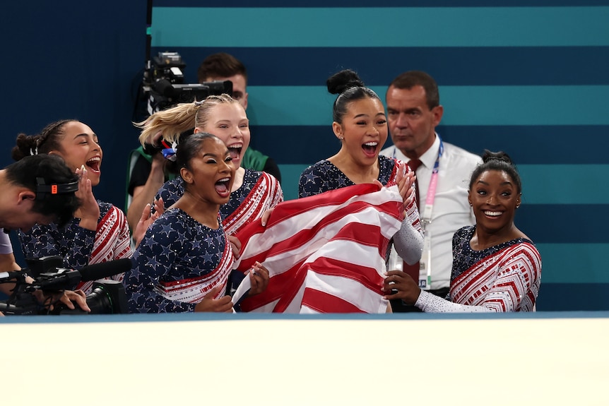 Simone Biles and Team USA teammates celebrate