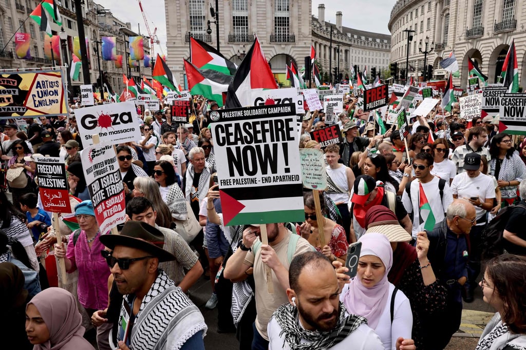 Protesters march in London during the “National March for Gaza”, calling to “end the genocide”, “stop arming Israel” and “no Middle East war” on Saturday. The health ministry in Gaza said that at least 39,550 Palestinians have been killed in nearly 10 months of war between Israel and Hamas. Photo: AFP