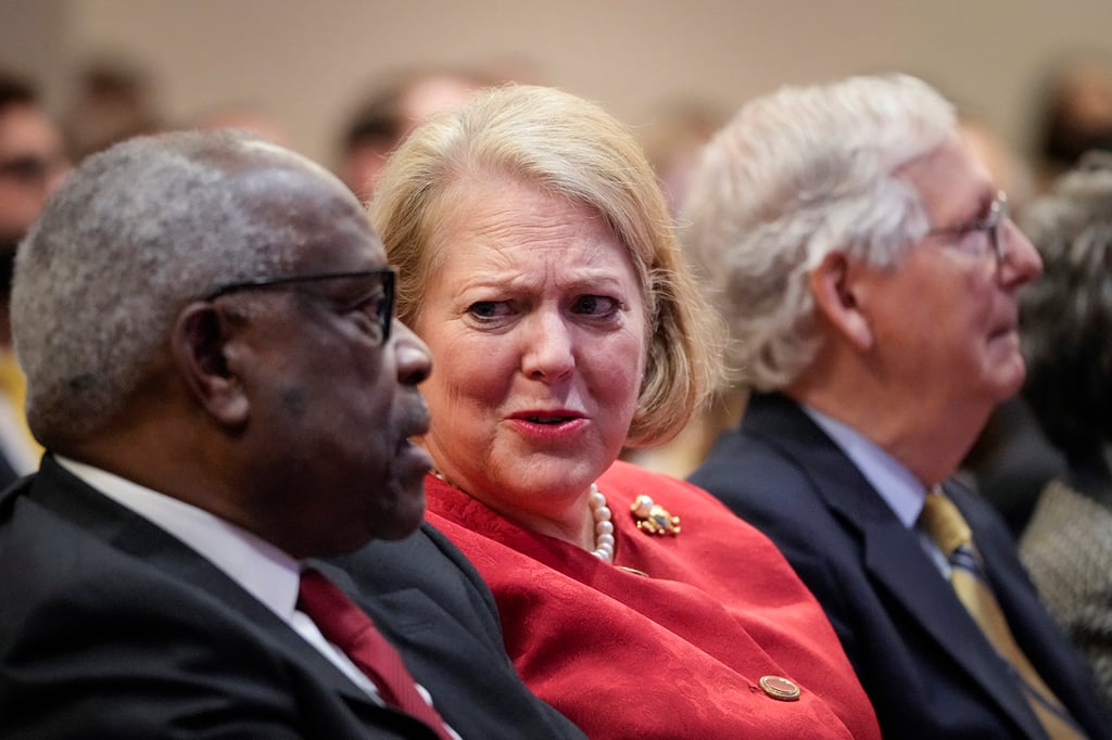 Justice Clarence Thomas and his wife Virginia Thomas speak to each other during an event at the Heritage Foundation in October 2021 in Washington. Photo: Getty Images/TNS
