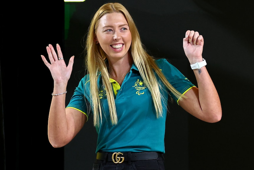 Lakeisha Patterson waves her hands after being unveiled at the Australian squad announcement for the Paris Paralympic Games.