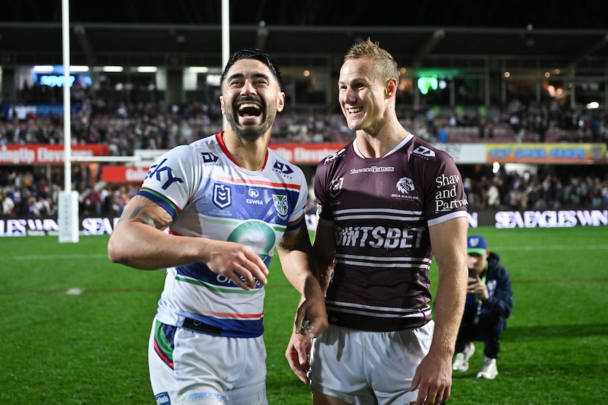 Two men greet each other after a rugby league match